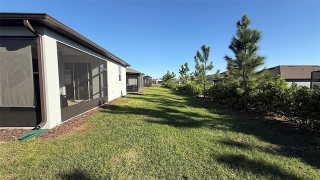 view of yard featuring a sunroom