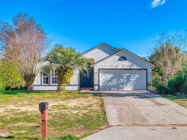 ranch-style home featuring stucco siding, driveway, and a garage