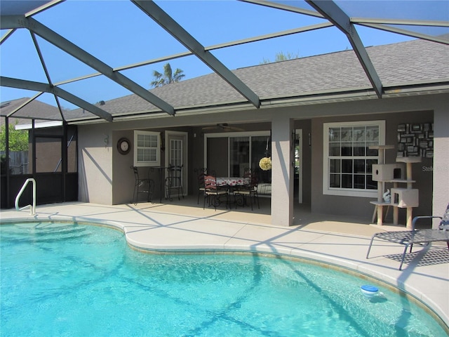 pool featuring a patio area, a lanai, and ceiling fan