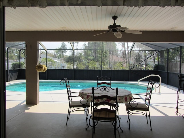 view of pool featuring ceiling fan, a fenced in pool, a patio, and a lanai