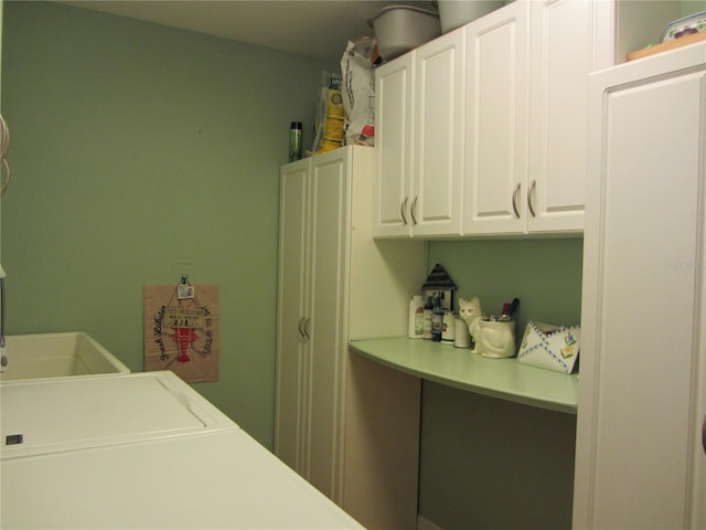 laundry room featuring cabinet space