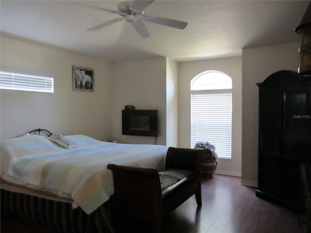 bedroom with wood finished floors and a ceiling fan