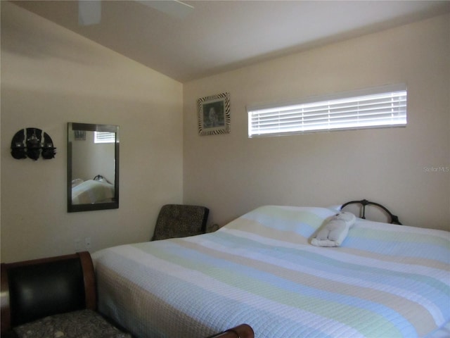 bedroom featuring vaulted ceiling