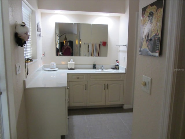 bathroom featuring tile patterned floors and vanity