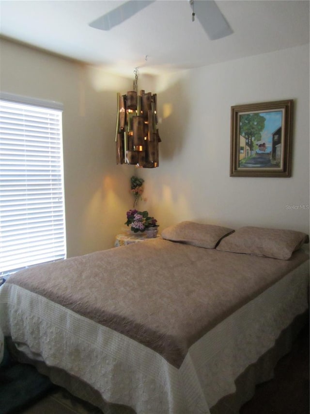 bedroom with a notable chandelier