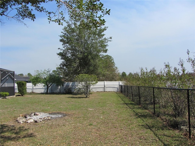 view of yard with a fenced backyard