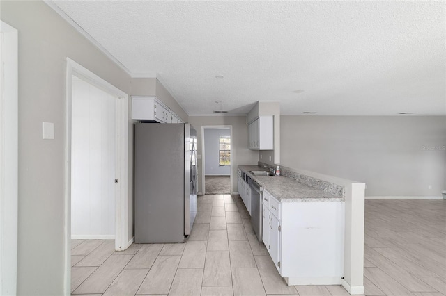 9951 NE 30th Ct, Anthony, FL 32617 - kitchen featuring white cabinetry, a sink, light countertops, and appliances with stainless steel finishes