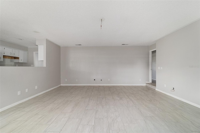 9951 NE 30th Ct, Anthony, FL 32617 - spare room with a textured ceiling, baseboards, and visible vents