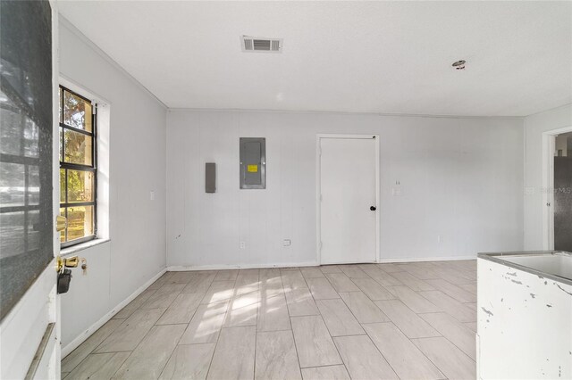 9951 NE 30th Ct, Anthony, FL 32617 - unfurnished room with baseboards, visible vents, and electric panel