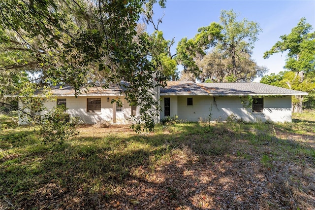 9951 NE 30th Ct, Anthony, FL 32617 - rear view of property featuring concrete block siding