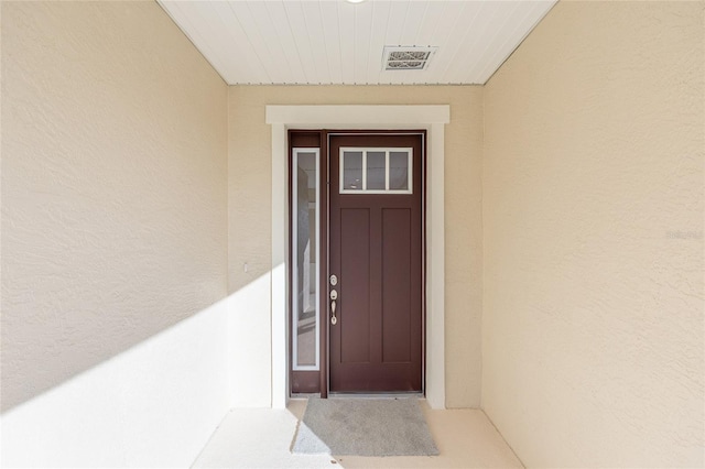 7731 SW 58th Pl, Ocala, FL 34474 - doorway to property with stucco siding