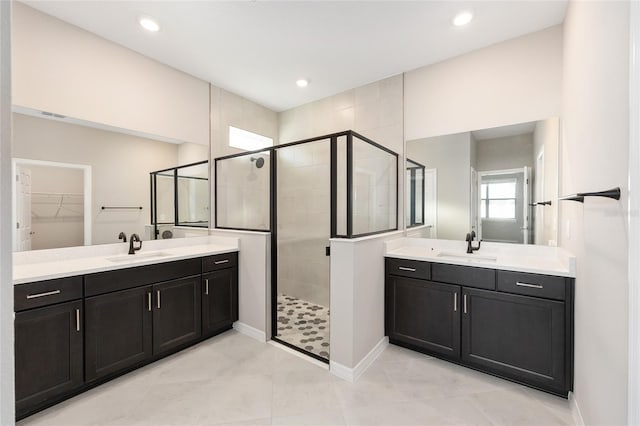 7731 SW 58th Pl, Ocala, FL 34474 - bathroom featuring a sink, two vanities, and a shower stall