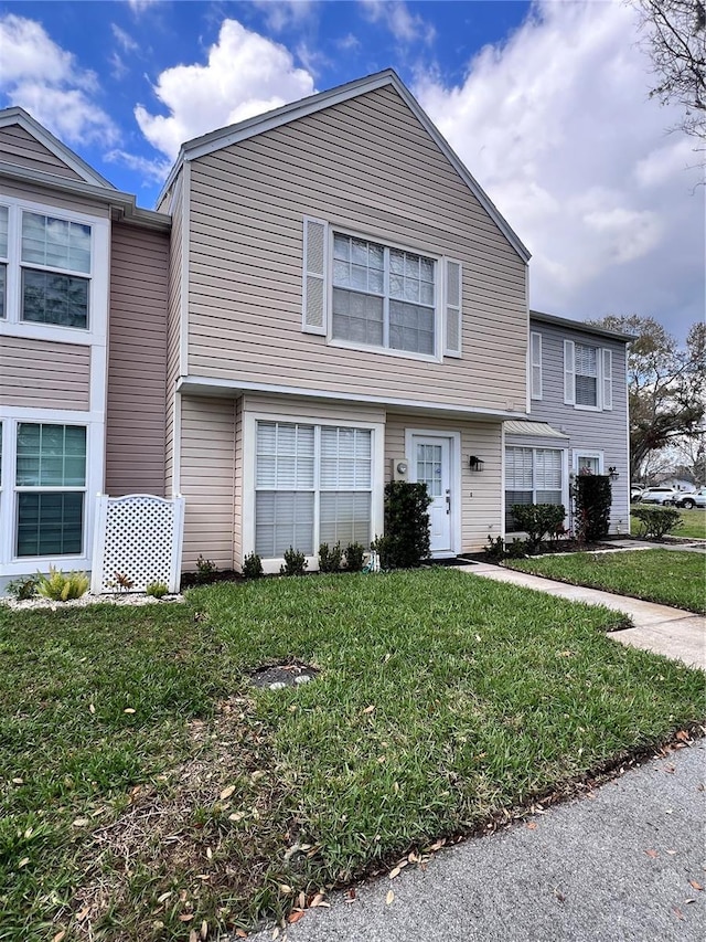 view of front of property with a front lawn