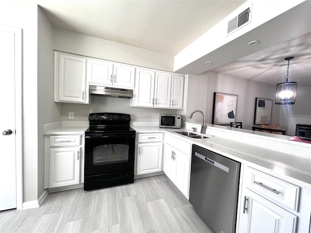 kitchen featuring visible vents, a sink, under cabinet range hood, white cabinetry, and appliances with stainless steel finishes