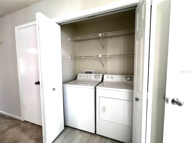 laundry room with laundry area and washer and clothes dryer