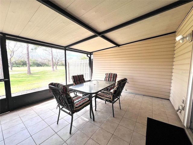 sunroom with beamed ceiling