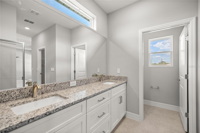 full bath featuring a sink, baseboards, and visible vents
