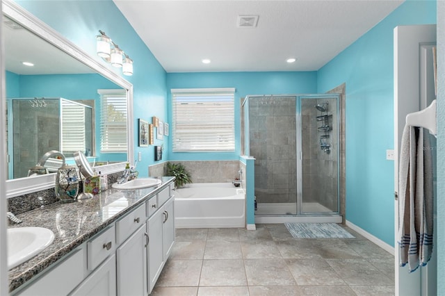 bathroom with a sink, visible vents, and a stall shower