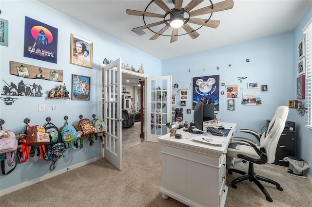 office space with visible vents, french doors, light colored carpet, and ceiling fan