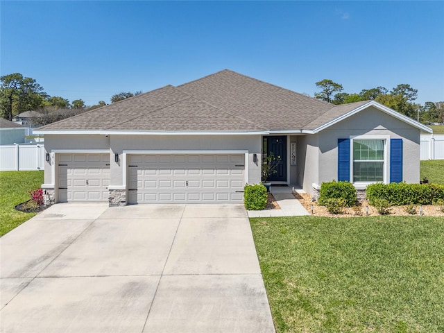 ranch-style home featuring a front yard, concrete driveway, a garage, and stucco siding