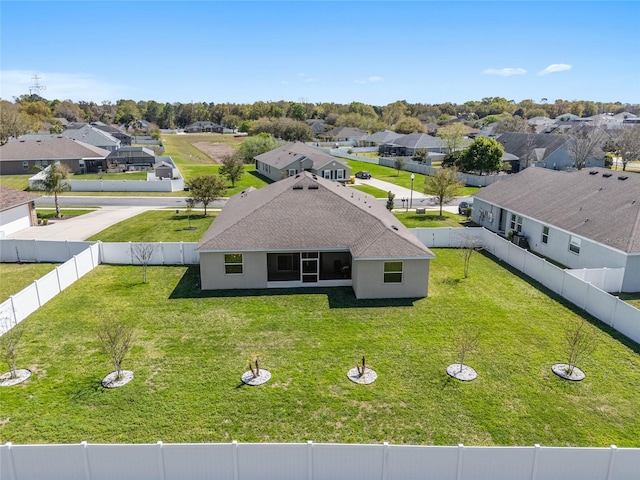 birds eye view of property with a residential view