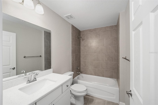 full bathroom with tile patterned floors, visible vents, toilet, washtub / shower combination, and vanity