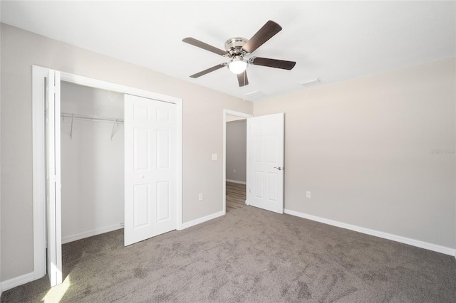 unfurnished bedroom featuring a closet, baseboards, carpet, and ceiling fan