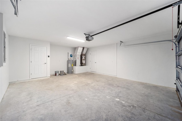 garage featuring a garage door opener and electric water heater