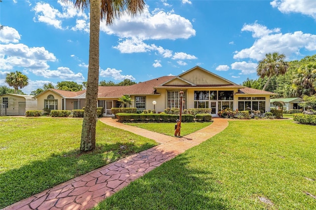 single story home with stucco siding and a front lawn