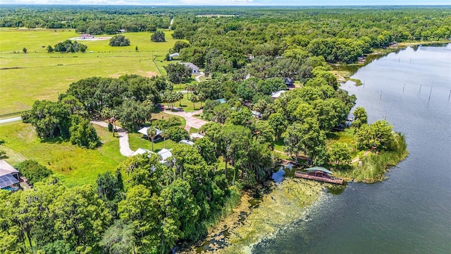 bird's eye view with a forest view and a water view