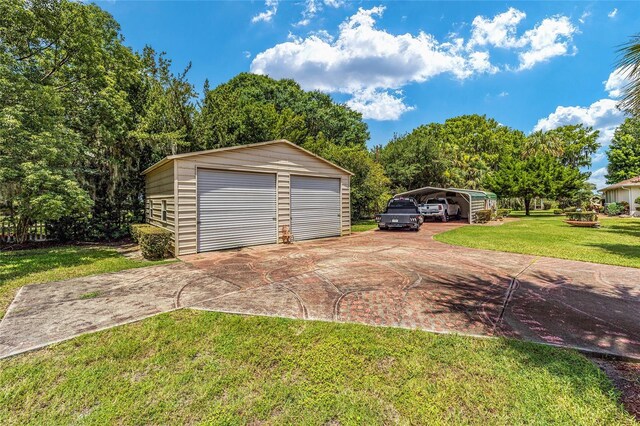 detached garage featuring a detached carport