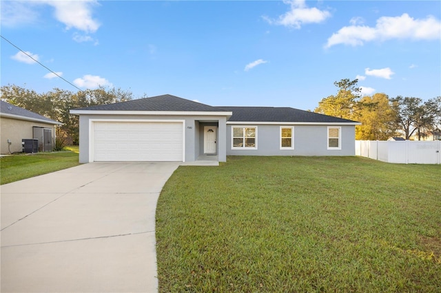 single story home with a front lawn, an attached garage, central AC unit, and concrete driveway