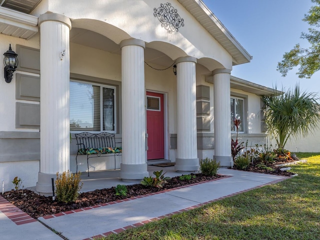 property entrance featuring stucco siding