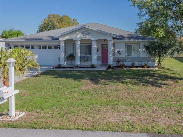 ranch-style house with a garage, roof with shingles, concrete driveway, and a front yard