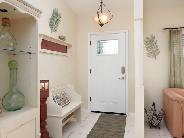 foyer entrance with light tile patterned flooring