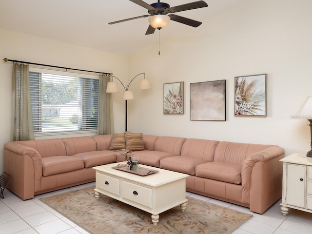 living area featuring light tile patterned floors and ceiling fan