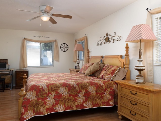 bedroom with wood finished floors and ceiling fan