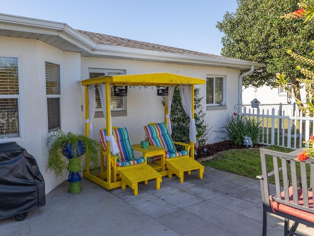 view of patio / terrace featuring fence