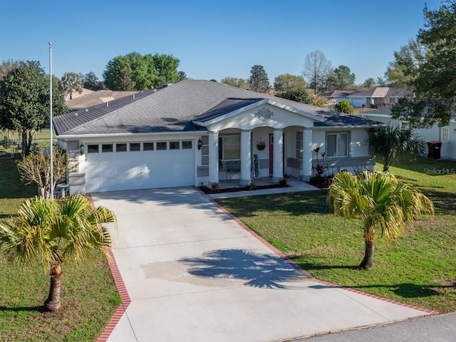 single story home with a front yard, roof with shingles, concrete driveway, and an attached garage