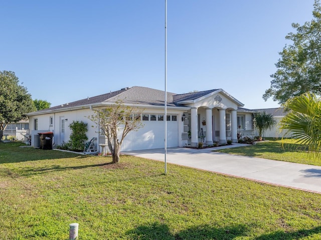 view of front facade with an attached garage, concrete driveway, and a front lawn