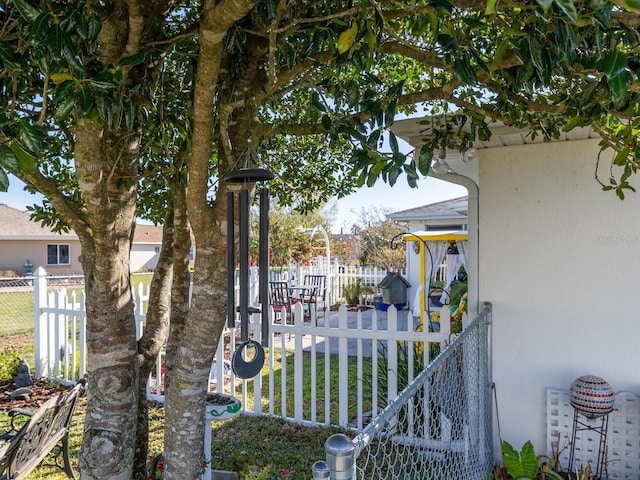 view of gate featuring fence