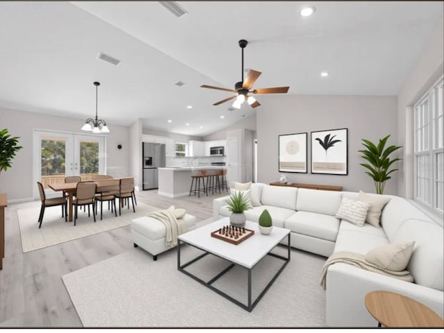 living room featuring visible vents, ceiling fan with notable chandelier, lofted ceiling, recessed lighting, and light wood-style flooring