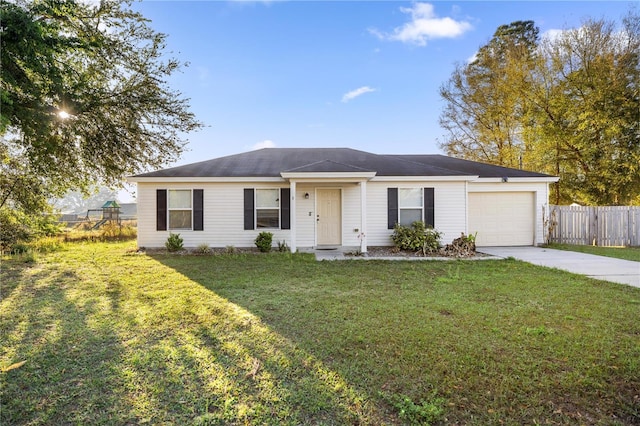 single story home featuring a front yard, concrete driveway, a garage, and fence