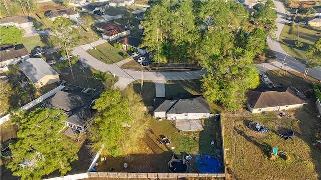 birds eye view of property with a residential view