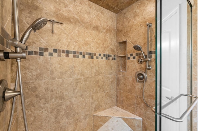 full bath with tiled shower