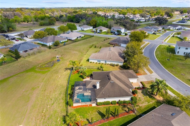 birds eye view of property with a residential view