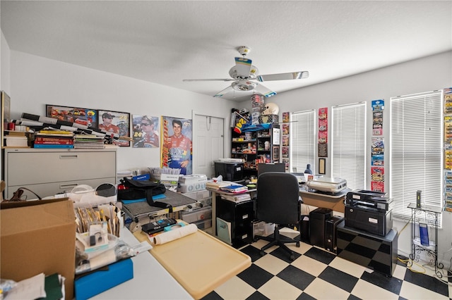 home office with tile patterned floors and a ceiling fan