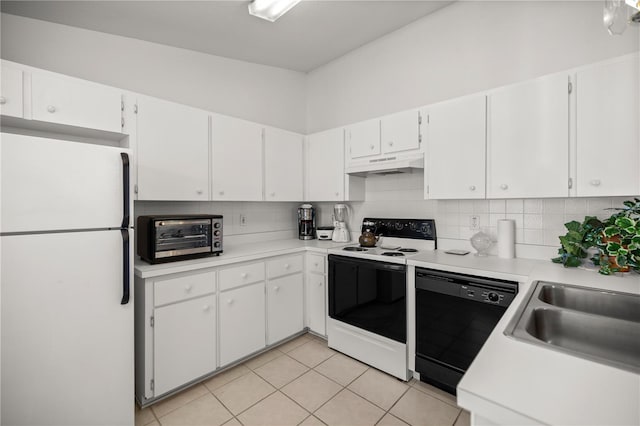 kitchen featuring a toaster, freestanding refrigerator, electric range oven, under cabinet range hood, and dishwasher