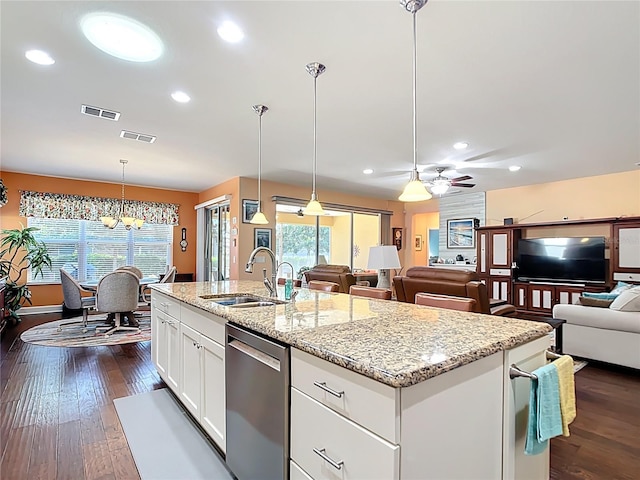 kitchen with visible vents, dark wood-type flooring, open floor plan, stainless steel dishwasher, and a sink