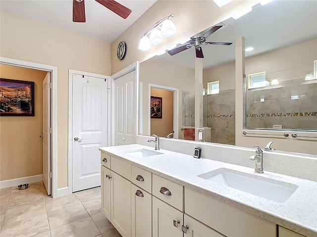 bathroom featuring a sink, walk in shower, and a ceiling fan